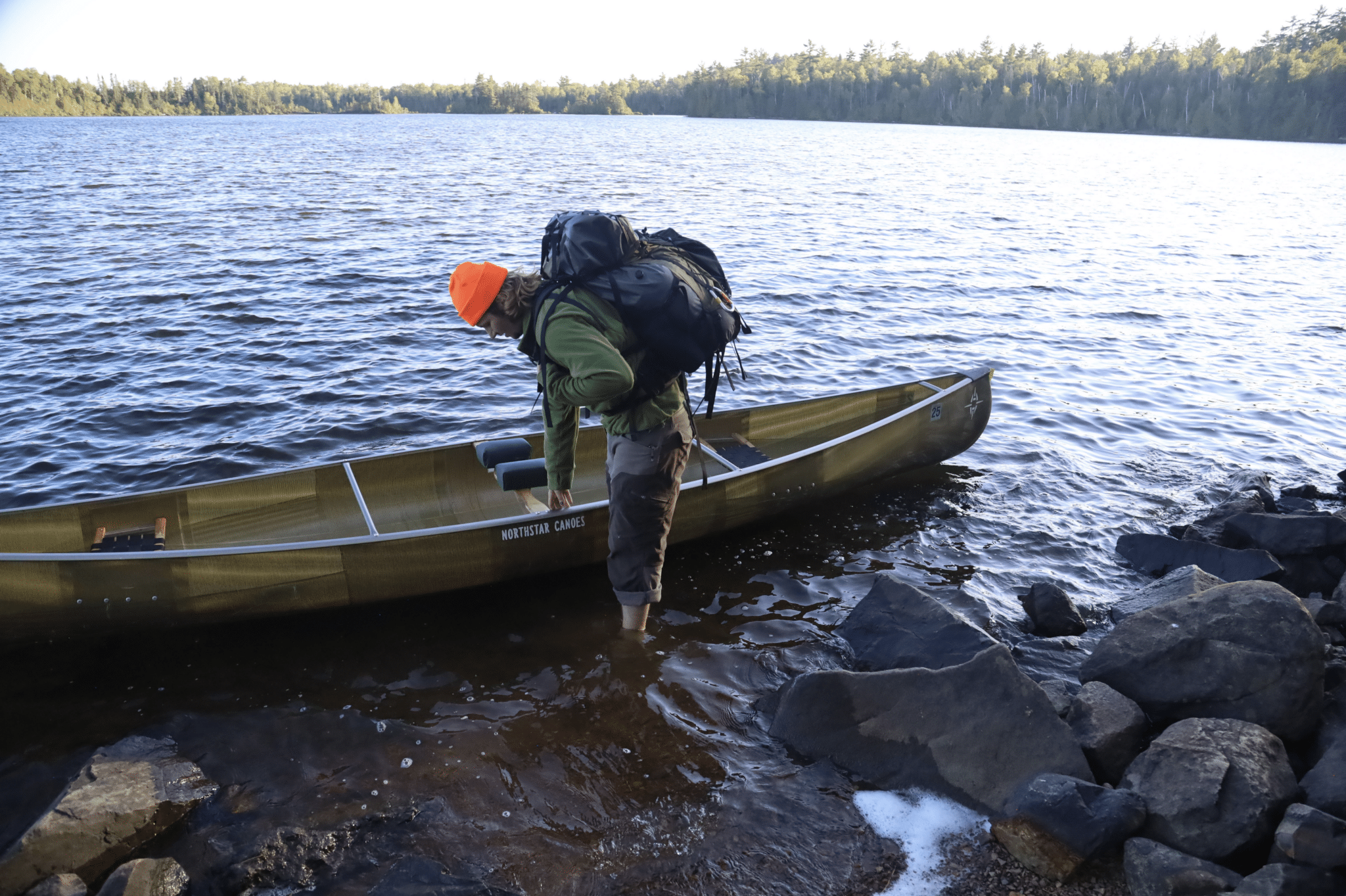 Getting into a canoe in the Boundary Waters.